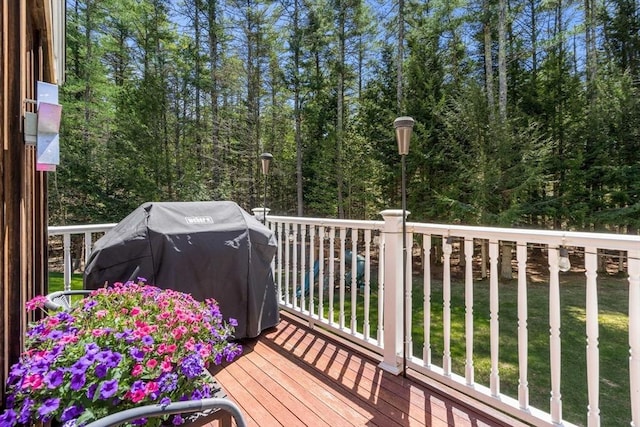 wooden terrace featuring area for grilling