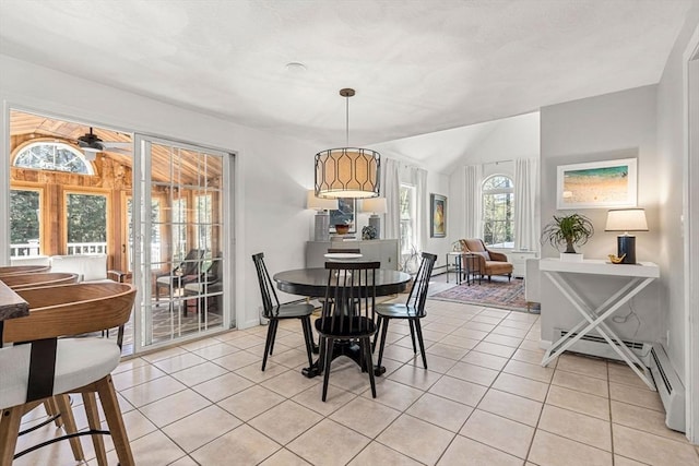 dining area featuring light tile patterned floors and baseboard heating