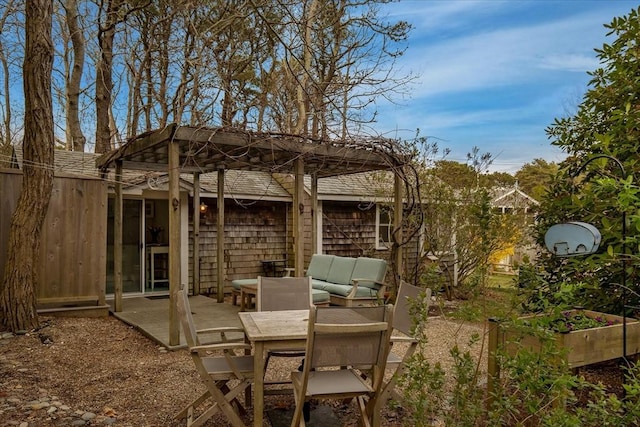 82 Shore Rd Unit 9, Truro, MA 02652 - view of patio / terrace with outdoor dining space and a vegetable garden