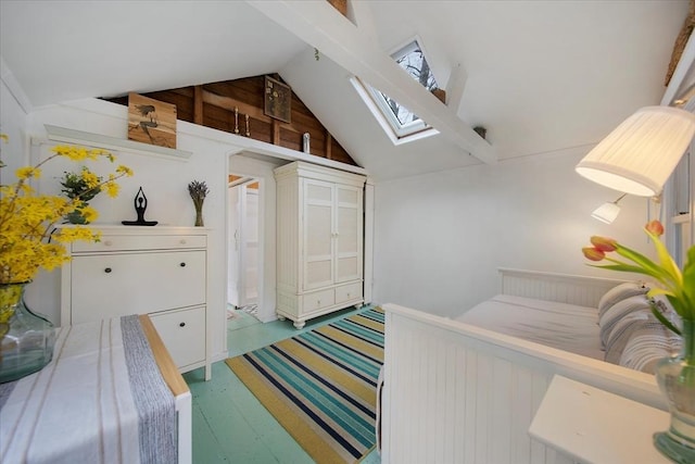 82 Shore Rd Unit 9, Truro, MA 02652 - staircase with a skylight, vaulted ceiling, and wood finished floors