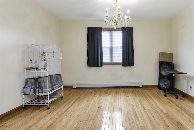 misc room with baseboards, a baseboard radiator, an inviting chandelier, and hardwood / wood-style flooring