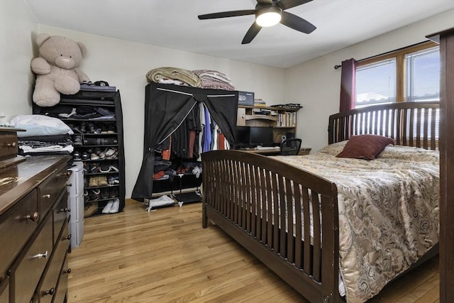 bedroom featuring a ceiling fan and light wood-style flooring