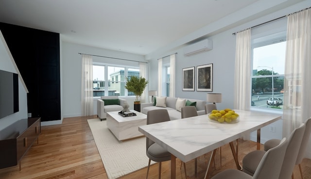 living room with light hardwood / wood-style flooring and a wall mounted air conditioner