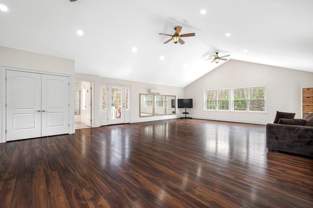 unfurnished living room featuring baseboards, lofted ceiling, wood finished floors, and ceiling fan