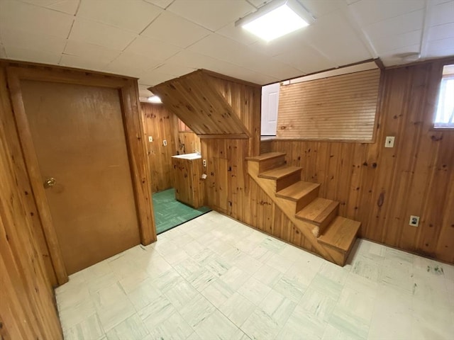 295 Atlantic, Quincy, MA 02171 - below grade area with wood walls, light floors, and stairway