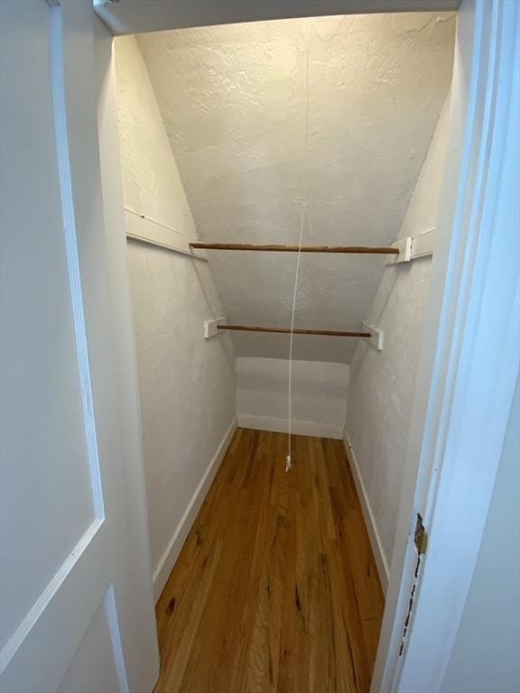 295 Atlantic, Quincy, MA 02171 - walk in closet featuring wood finished floors and lofted ceiling