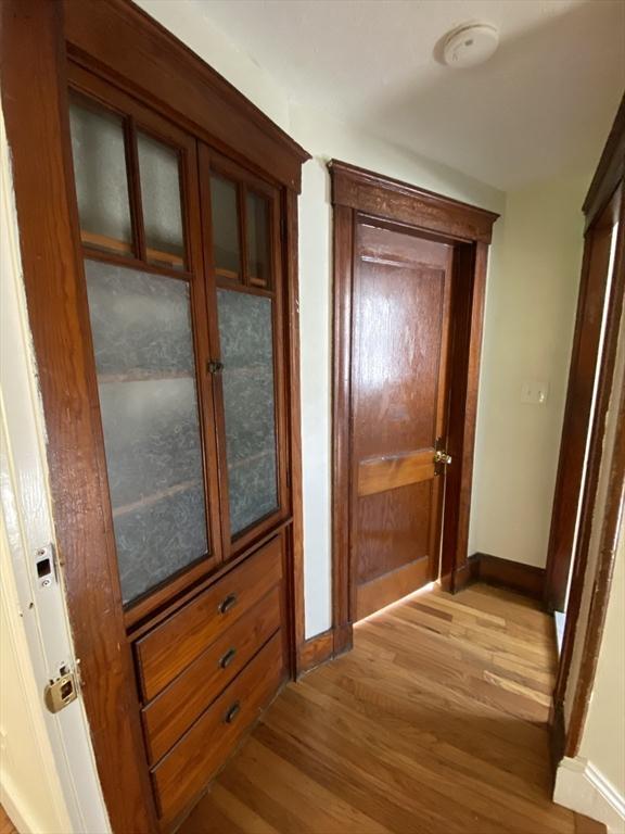 295 Atlantic, Quincy, MA 02171 - hallway featuring light wood-style flooring and baseboards