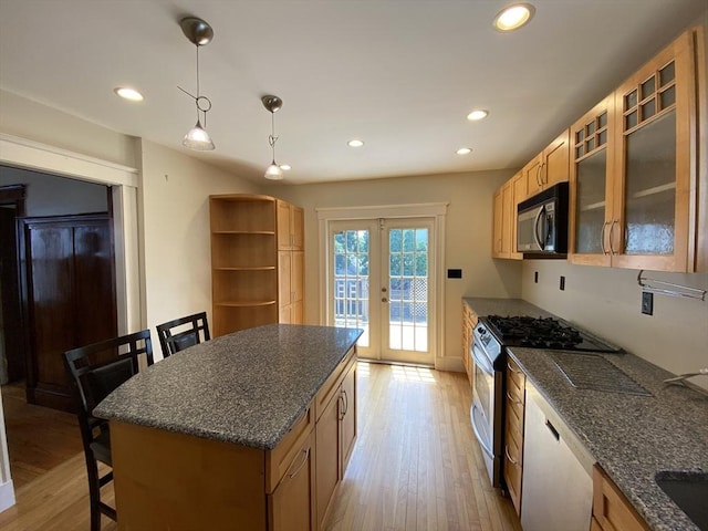 295 Atlantic, Quincy, MA 02171 - kitchen featuring appliances with stainless steel finishes, french doors, light wood-type flooring, a kitchen breakfast bar, and recessed lighting