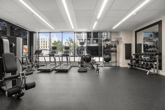 gym with a wall of windows