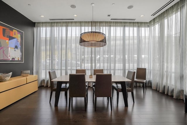 dining space featuring a healthy amount of sunlight and wood finished floors