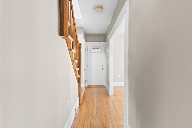 hall with light hardwood / wood-style floors