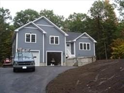 raised ranch featuring a garage