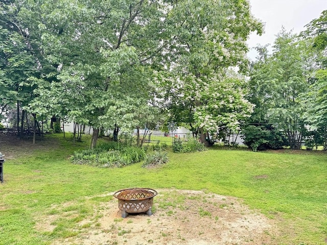 169 Beauchamp Ter, Chicopee, MA 01020 - view of grassy yard featuring a fire pit