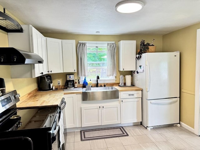 169 Beauchamp Ter, Chicopee, MA 01020 - kitchen with freestanding refrigerator, stainless steel electric range oven, wood counters, and white cabinetry