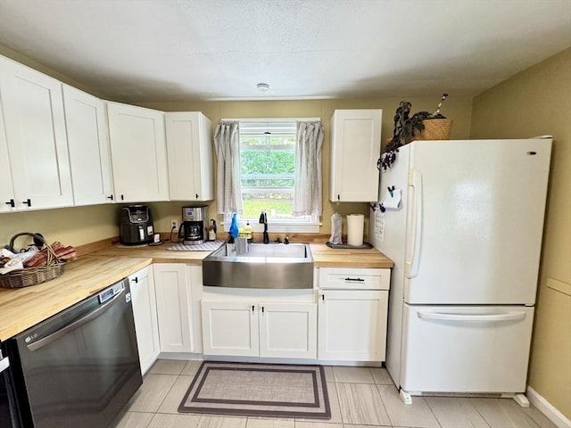 169 Beauchamp Ter, Chicopee, MA 01020 - kitchen with freestanding refrigerator, dishwasher, wooden counters, and white cabinets