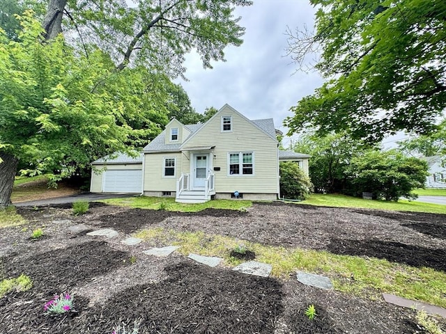 169 Beauchamp Ter, Chicopee, MA 01020 - view of front of house with a detached garage, entry steps, and an outdoor structure