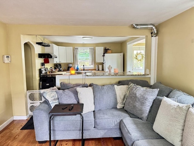 169 Beauchamp Ter, Chicopee, MA 01020 - living area featuring wood finished floors and arched walkways