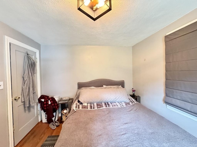 169 Beauchamp Ter, Chicopee, MA 01020 - bedroom with a textured ceiling and wood finished floors