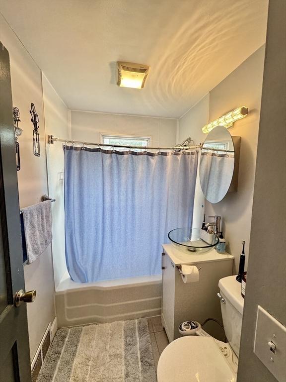 169 Beauchamp Ter, Chicopee, MA 01020 - full bath with shower / bathtub combination with curtain and tile patterned floors