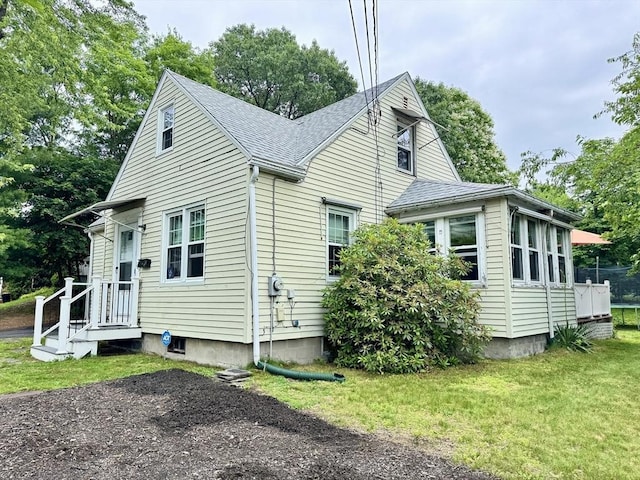 169 Beauchamp Ter, Chicopee, MA 01020 - view of side of home with roof with shingles and a yard