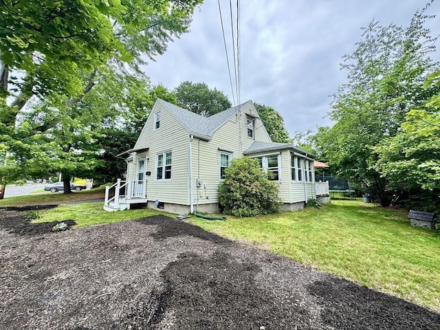 169 Beauchamp Ter, Chicopee, MA 01020 - view of property exterior with a yard