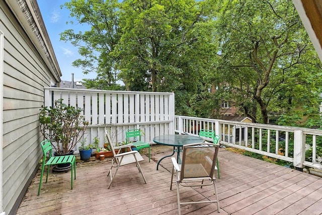 338 Harvard St Unit 1, Cambridge, MA 02139 - wooden terrace with outdoor dining area