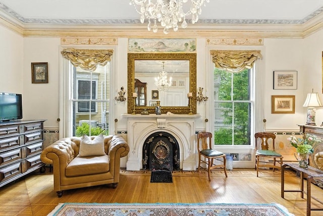 338 Harvard St Unit 1, Cambridge, MA 02139 - sitting room featuring a chandelier, crown molding, wood finished floors, and a fireplace