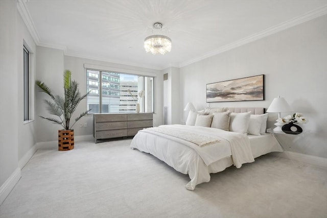 carpeted bedroom with a notable chandelier, baseboards, and ornamental molding