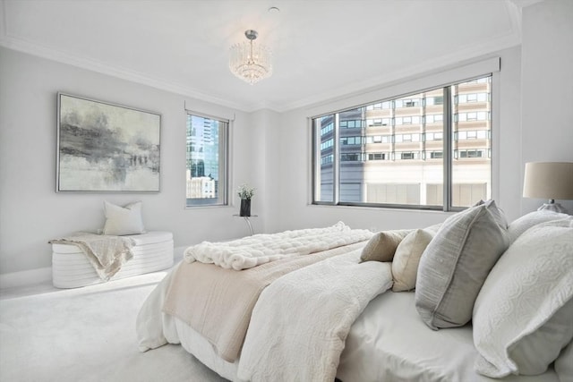 bedroom featuring crown molding, baseboards, and carpet floors