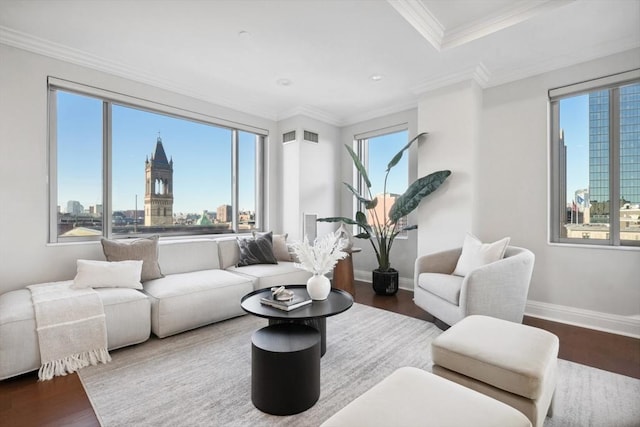 living room with a city view, crown molding, plenty of natural light, and wood finished floors