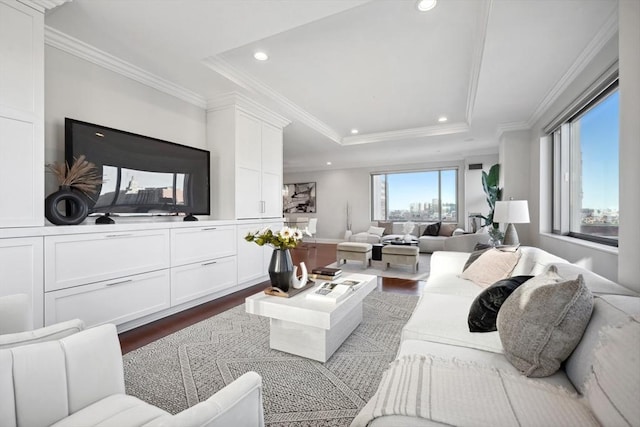 living area with recessed lighting, a raised ceiling, dark wood-style flooring, and crown molding