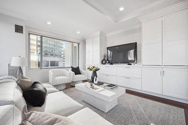 living area with recessed lighting, visible vents, dark wood finished floors, and ornamental molding