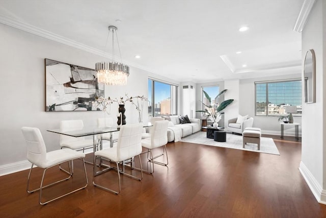 dining space with dark wood finished floors, recessed lighting, crown molding, and baseboards