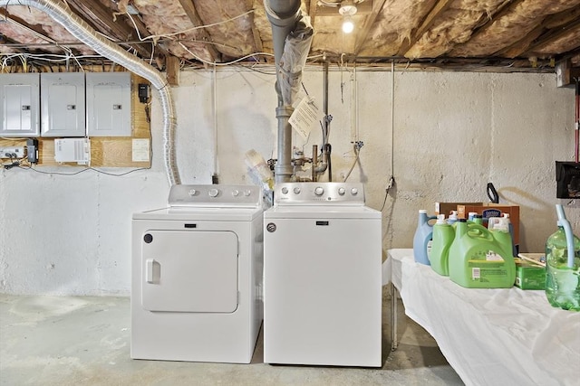 clothes washing area featuring separate washer and dryer and electric panel