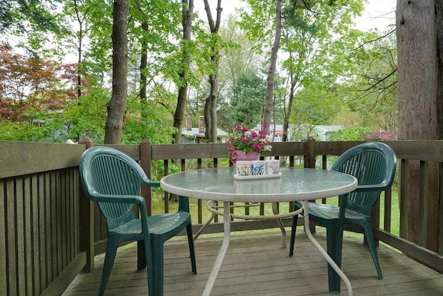 wooden deck with outdoor dining space