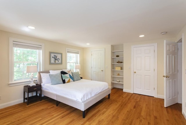 bedroom with light hardwood / wood-style flooring