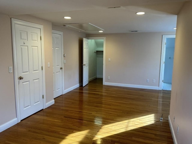 spare room with dark wood-type flooring