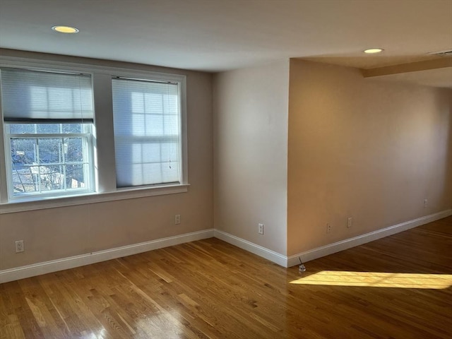 unfurnished room featuring hardwood / wood-style floors