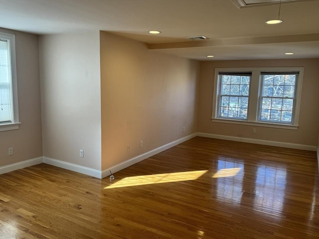 unfurnished room featuring hardwood / wood-style floors