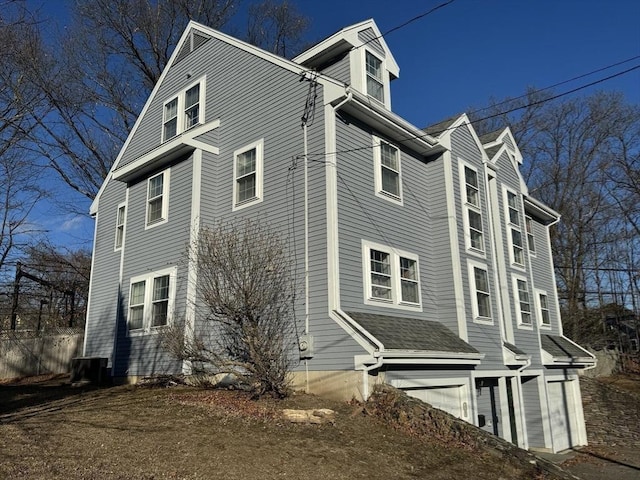 view of side of home featuring a garage