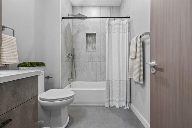 full bath featuring tile patterned flooring, vanity, toilet, baseboards, and shower / tub combo