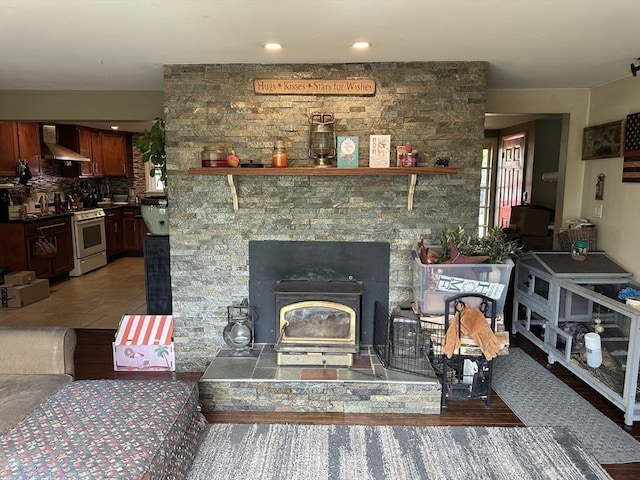 living area featuring a wood stove