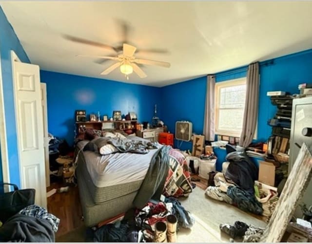 bedroom with wood finished floors and ceiling fan