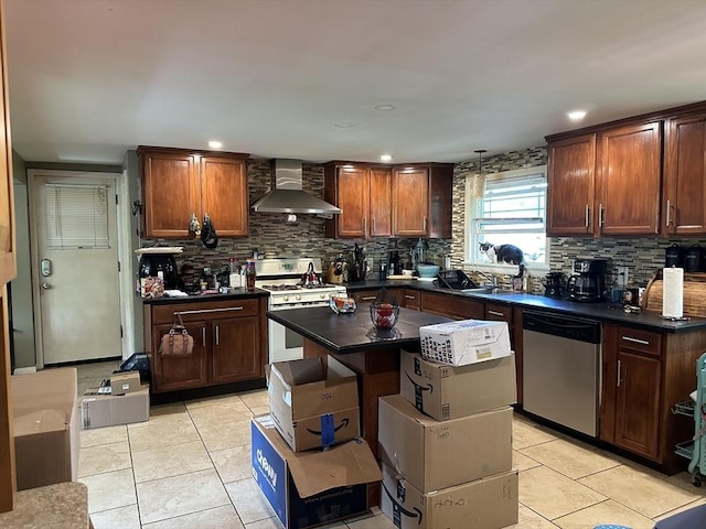 kitchen featuring stainless steel dishwasher, wall chimney range hood, white range with gas cooktop, backsplash, and light tile patterned floors