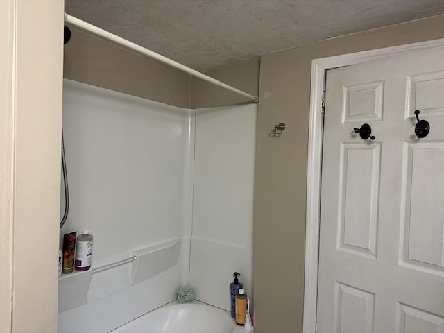 bathroom with shower / tub combination