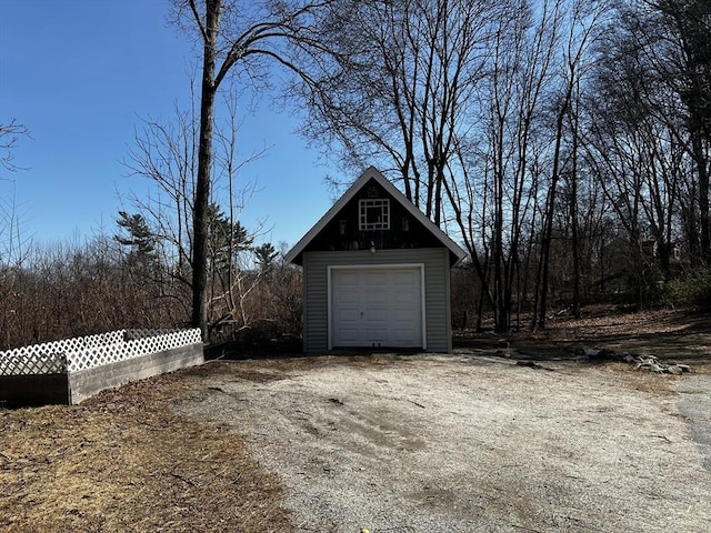detached garage featuring driveway