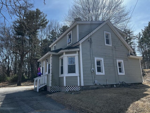 view of home's exterior with entry steps