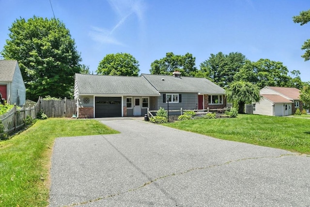 683 Rogers Ave, West Springfield, MA 01089 - ranch-style home featuring a garage, asphalt driveway, and brick siding
