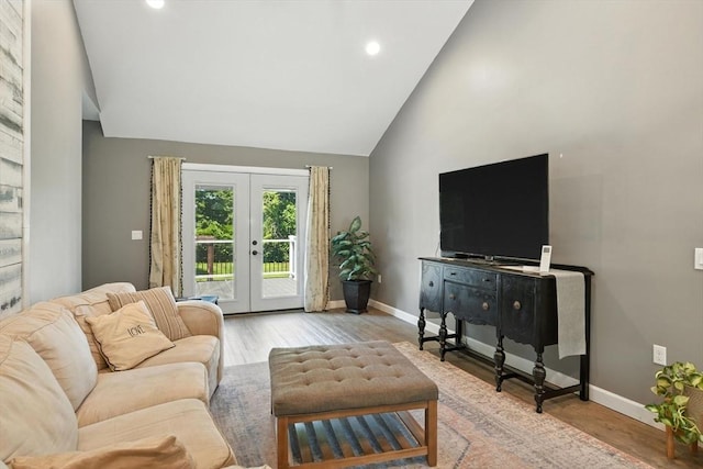 683 Rogers Ave, West Springfield, MA 01089 - living area with french doors, wood finished floors, recessed lighting, and high vaulted ceiling