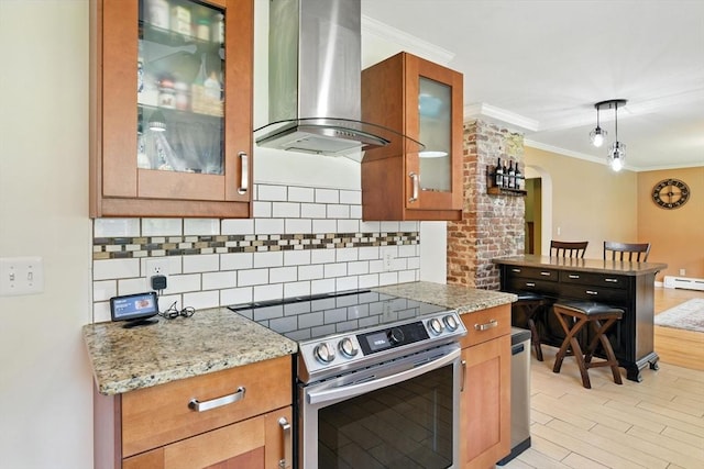 683 Rogers Ave, West Springfield, MA 01089 - kitchen featuring electric range, wall chimney range hood, backsplash, crown molding, and light wood-style floors